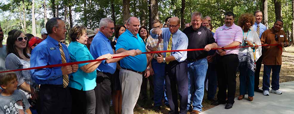 Peaple at a ribbon cutting
